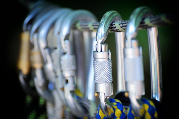 Climbing sports image of a carabiner on a rope in a forest