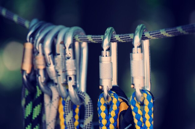 Climbing sports image of a carabiner on a rope in a forest