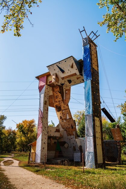 Climbing wall in the autumn city park. Photo taken in Russia, in Barnaul