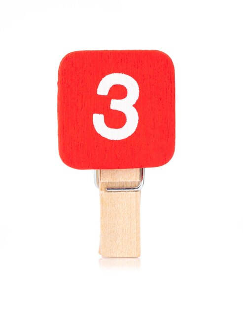 clip wooden peg with numbers 3 isolated on a white background