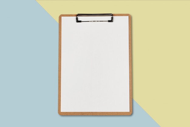 Photo clipboard with white sheet on pastel color background, minimal concept