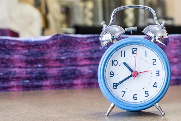 The clock standing on the desktop Employment and labor Alarm