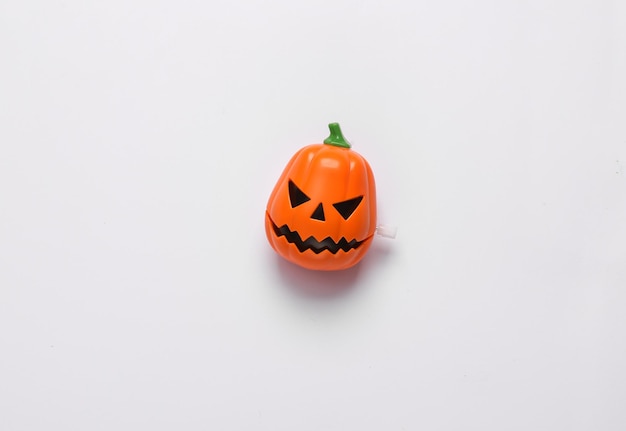 Clockwork toy jack pumpkin head on a white background Halloween decor