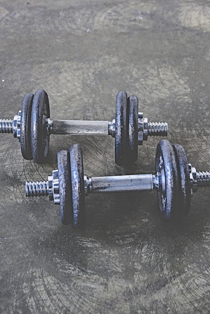 Photo close shot adjustable dumbbells concrete