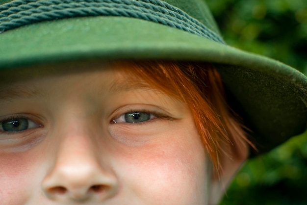 Close shot of a boy of eight years old with red hair childhood concept