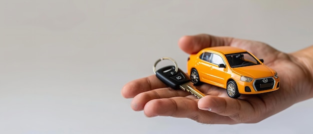 A close shot of a hand is holding a car key and a toy car is standing in front of it against a studio white backdrop with space Generative AI