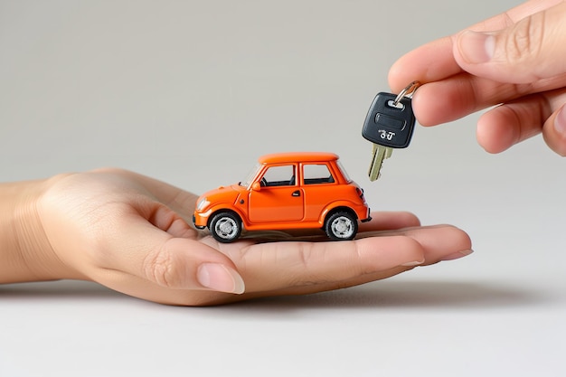 A close shot of a hand is holding a car key and a toy car is standing in front of it against a studio white backdrop with space Generative AI