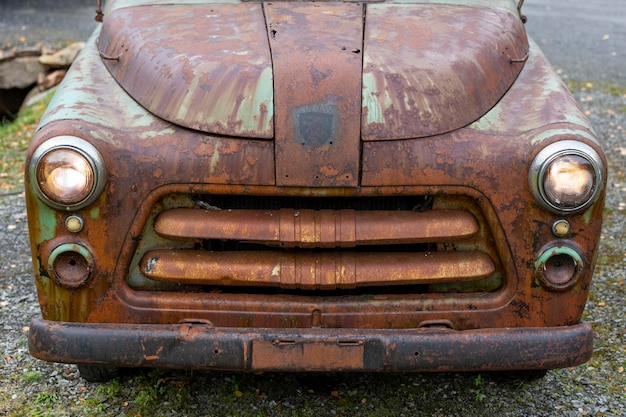 Close up of abandoned car on field, Norway