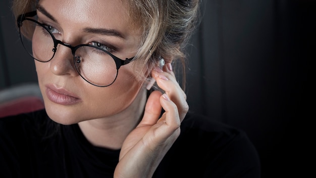 Close-up adult businesswoman with eyeglasses