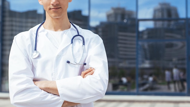 Close up ambulance doctor standing on a city street