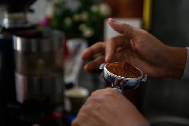 Close-up of Americano pouring from coffee machine. Professional coffee brewing