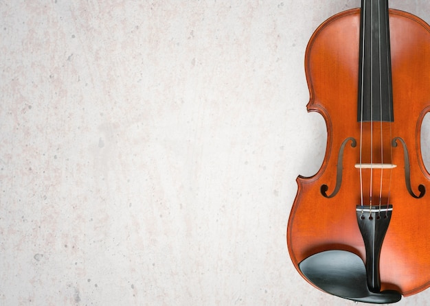 Close-up antique classical Violin on grey background