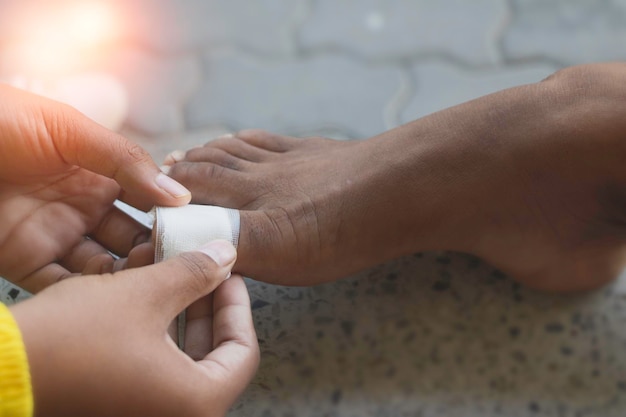 Close up Asian child feet with an adhesive Foot first aid plasterphoto Hospital and first aid concept