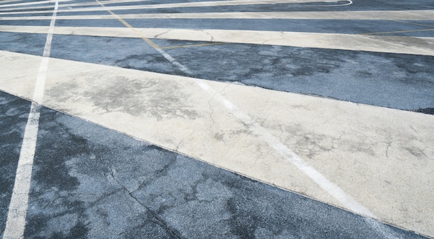 Close up asphalt road surface with white traffic strip