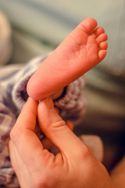 Close up baby bare foot concept photo