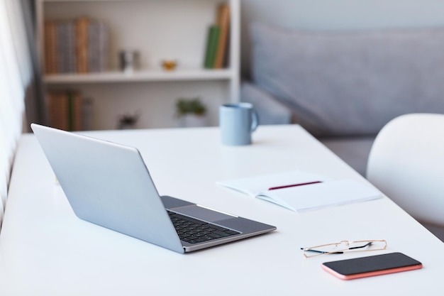 Close up background image of home office workplace with laptop copy space