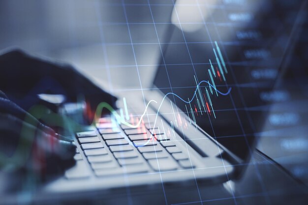 Close up of backlit female hands using laptop keyboard with growing forex chart on blurry background Trade finance and stock concept Double exposure