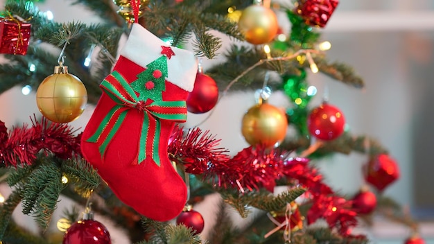 Close up of balls on Christmas tree. Bokeh garlands in the background. New Year concept.