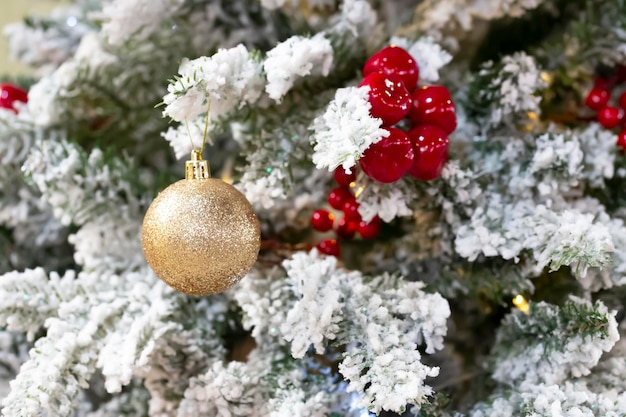 Close up of balls on christmas tree Bokeh garlands in the background