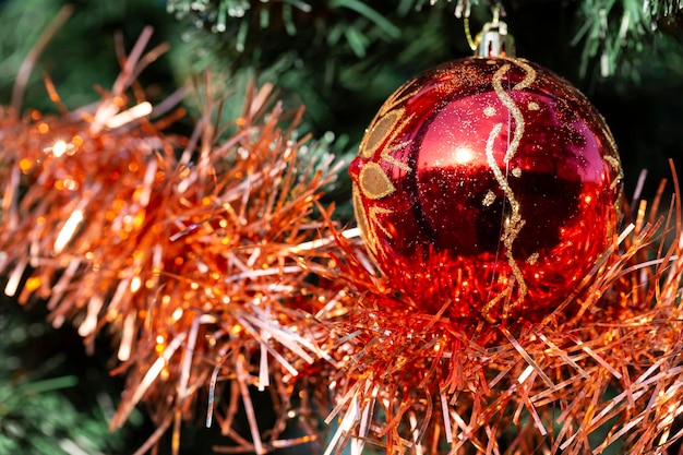 Close up of balls on christmas tree Bokeh garlands in the background