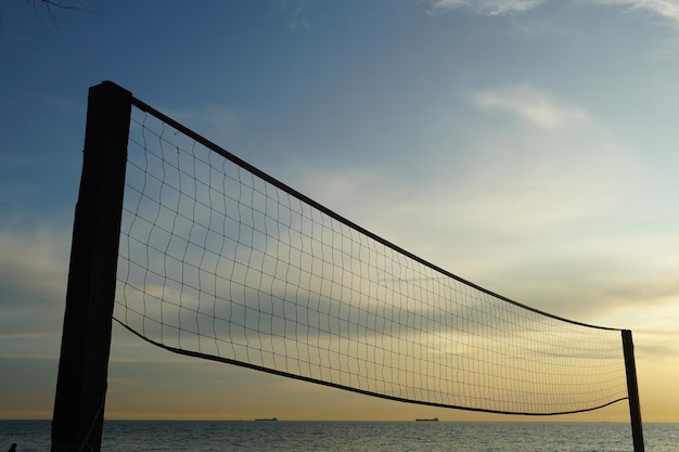 Photo close up of beach volleyball against blue sky