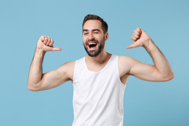 Close up bearded young man 20s years old perfect skin wearing white shirt isolated on blue pastel wall background, studio portrait. Skin care healthcare cosmetic procedures concept. Mock up copy space