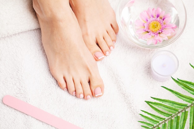 Close up of beautiful legs of a woman doing a pedicure