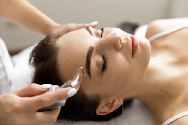 Close-up of a beautiful woman doing treatments at a spa