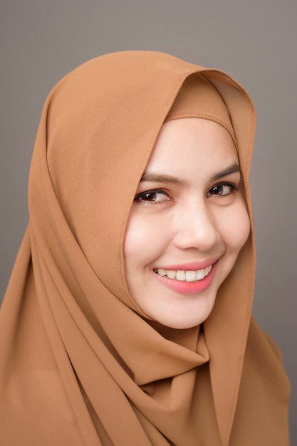 Close up beautiful woman with hijab on gray background