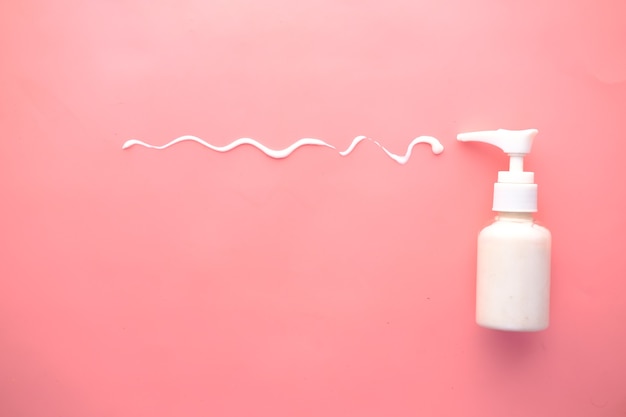 Close up of beauty cream in a pink container