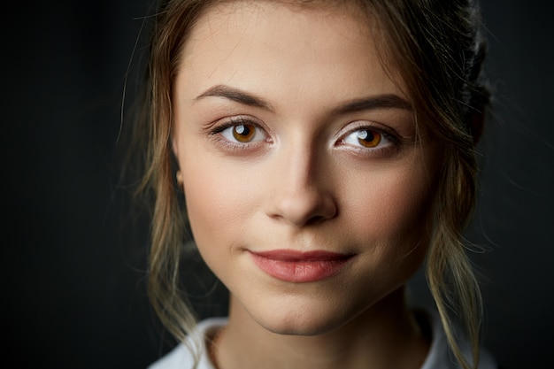 Close up beauty portrait on dark wall