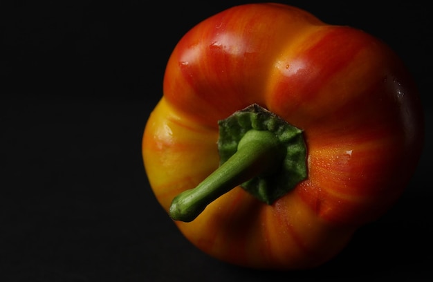 Close-up of bell peppers against black background