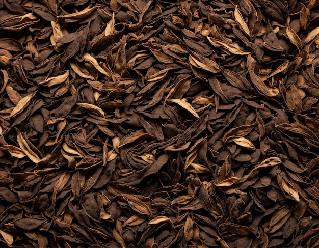 Close up black dry tea leaves wallpaper background Texture full frame banner or poster dried tea Dark abstract food and drink backdrop Advertising concept High quality photo Copy ad text space