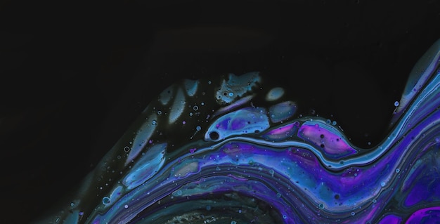 A close up of a black and purple abstract painting