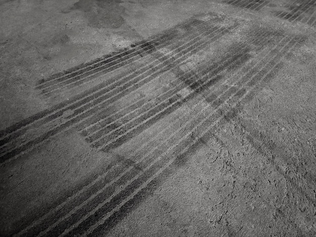 Close up black tire marks on cement floor