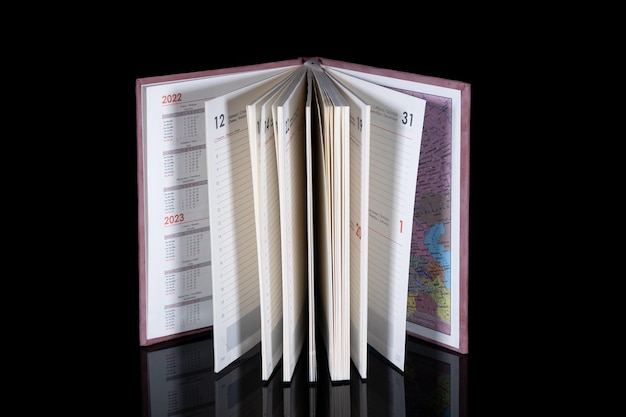 Close up of a blank velour fluffy notebook on black background with clipping path