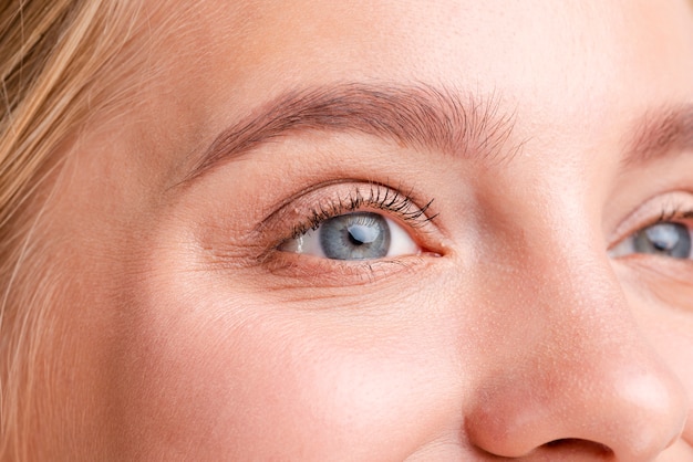 Close-up blonde woman with beautiful blue eyes