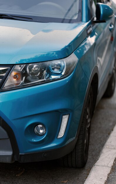 Close up of blue avtomobil parked on urban street