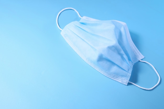 Close up of blue surgical masks on table