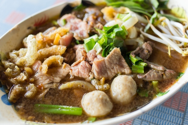 close up boat culture noodles style rice stick noodles with blood soup which put blood in the soup