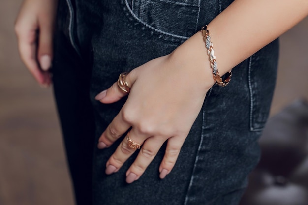 Close up of boho styled woman hands with silver jewelry