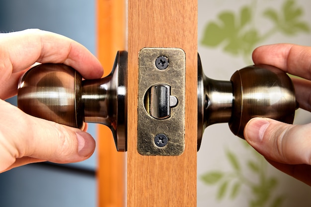 Close-up brass door handles or knob with lock.