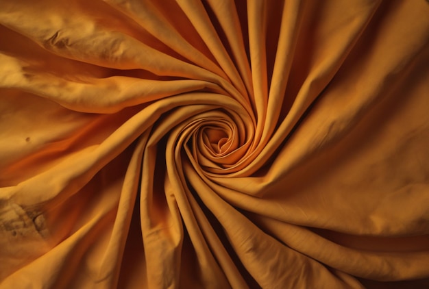 A close up of a brown and orange flower