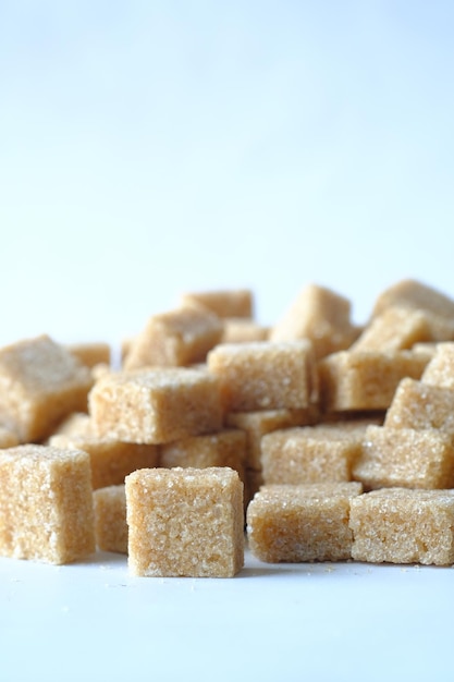 Close up of brown sugar cube on white background