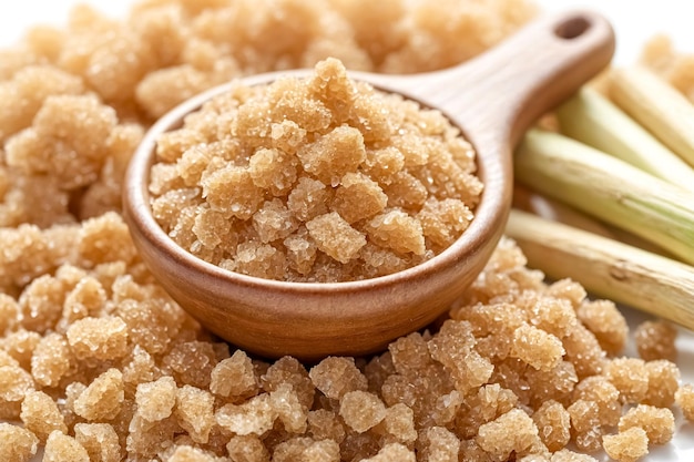 Close up of brown sugar in a wooden spoon