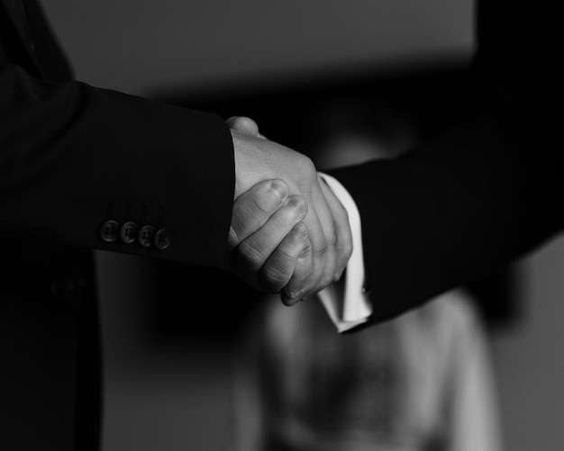 Close up of business handshake between colleagues