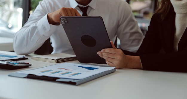 Close up of Business team analyzing income charts and graphs with modern laptop computer Business analysis and strategy concept