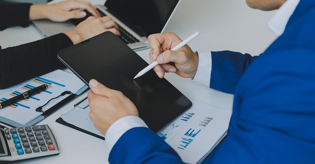 Close up of Business team analyzing income charts and graphs with modern laptop computer Business analysis and strategy concept