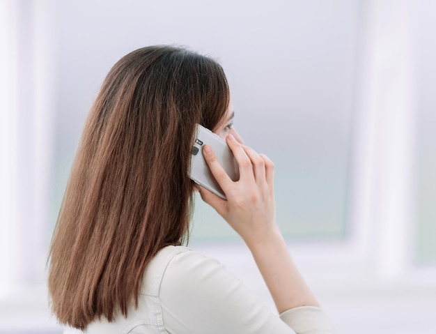 Close up business woman talking on a mobile phone