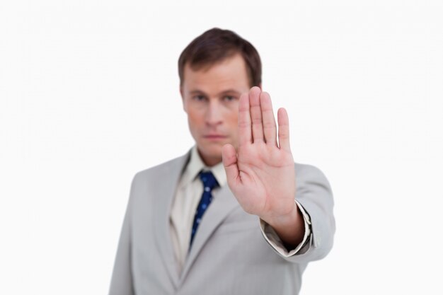 Close up of businessman signalizing stop